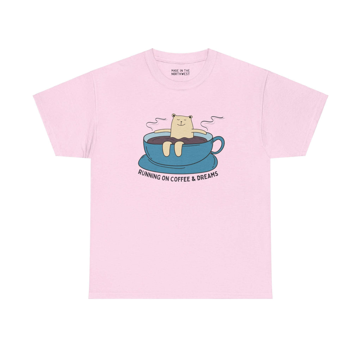 Pink tee with a bear lounging in a coffee cup, featuring the text 'Running on Coffee and Dreams', perfect for coffee lovers.