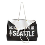 Home is in Seattle weekender bag featuring a small axe and tree design, perfect for stylish weekend adventures.