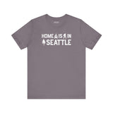 Home Is in Seattle Tee featuring campfire, Bigfoot, and tree designs celebrating Seattle pride.