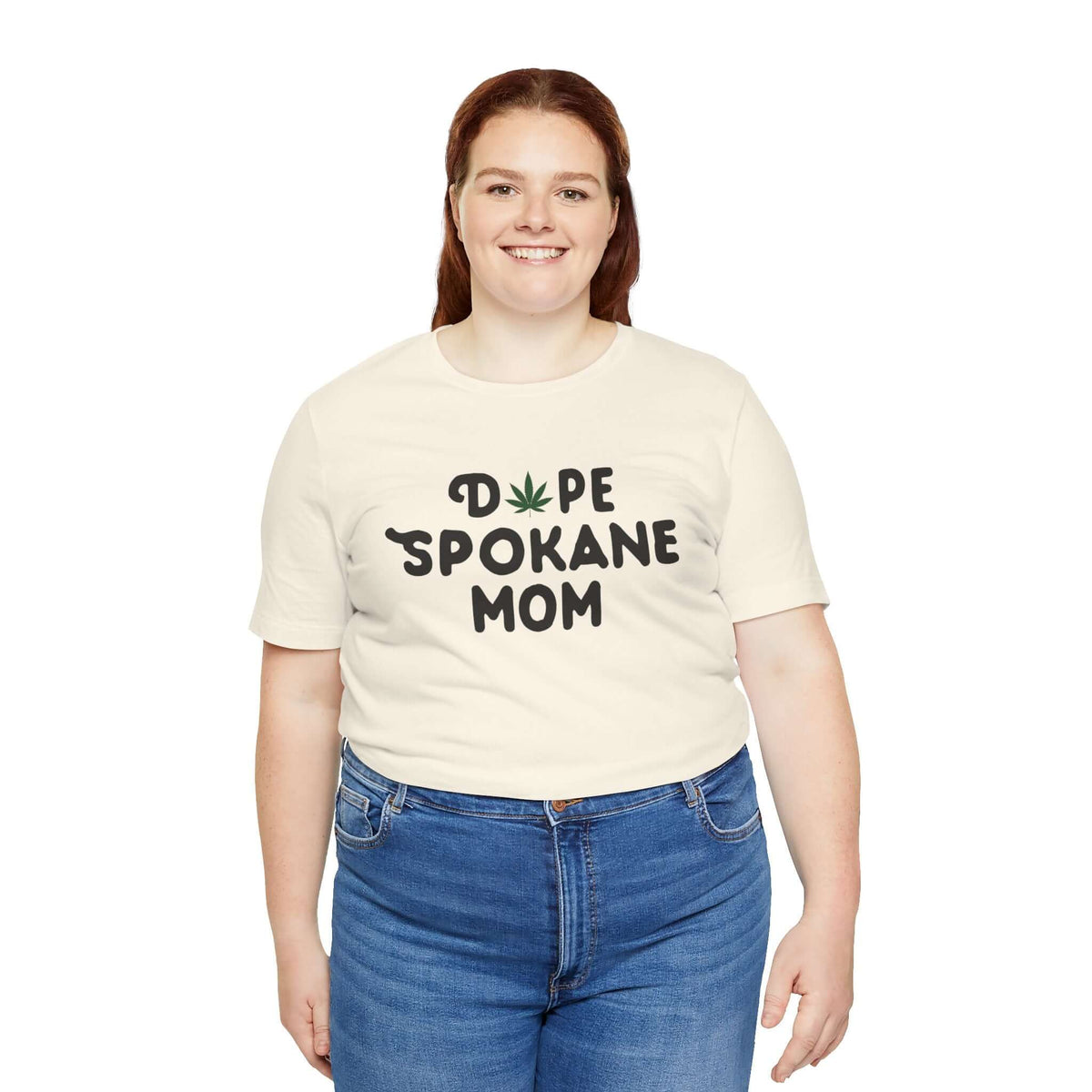 Woman wearing Dope Spokane Mom t-shirt with marijuana leaf design, celebrating Washington state's unique style and vibe.