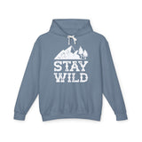 Stay Wild hoodie featuring a mountain and tree graphic on a blue sweatshirt.