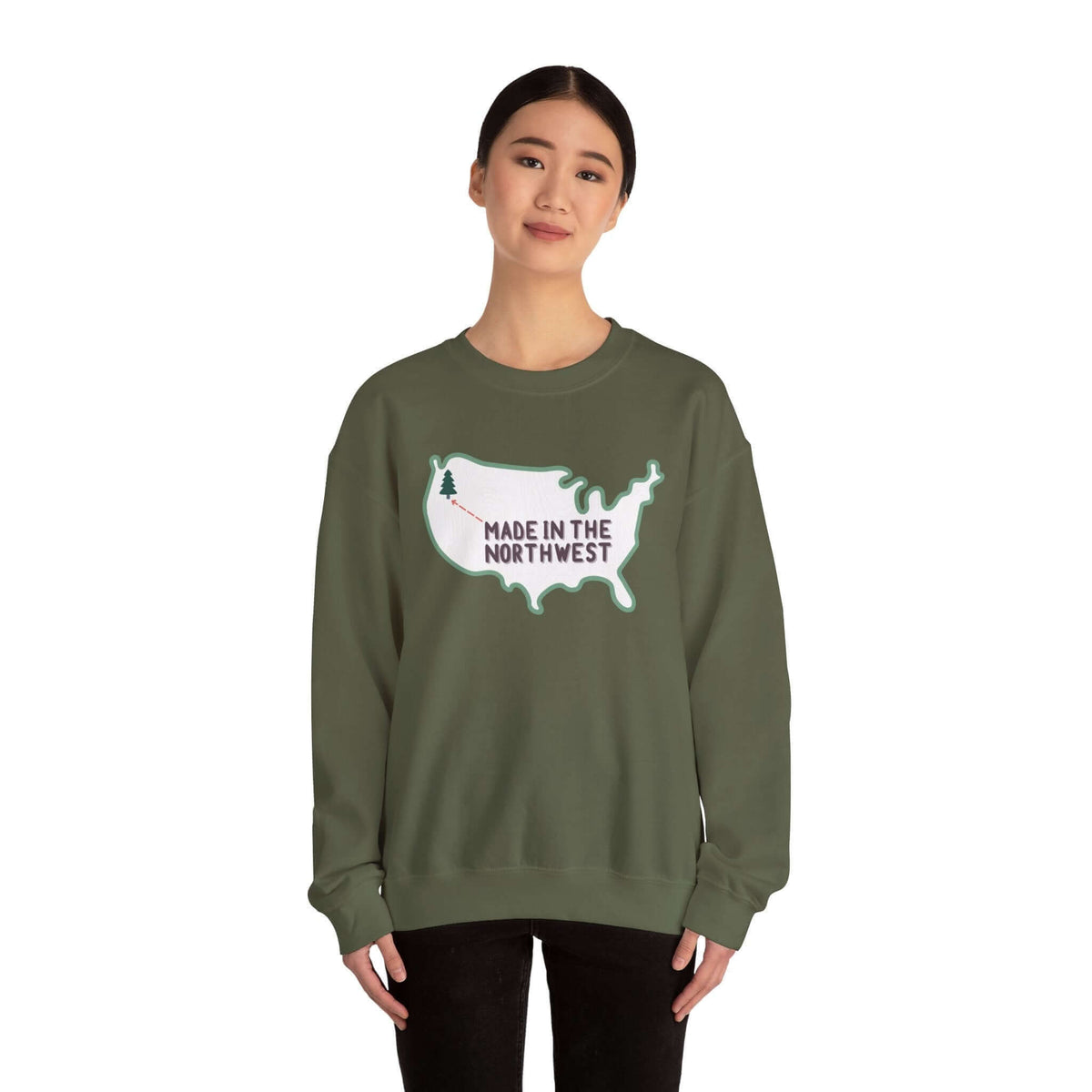 Evergreen is Where It's At Sweatshirt Show your love for the Pacific Northwest with our exclusive "Evergreen is Where it's At" sweatshirt. This design features the woodgrain United States with a tree marking the PNW location, highlighted by an arrow and t