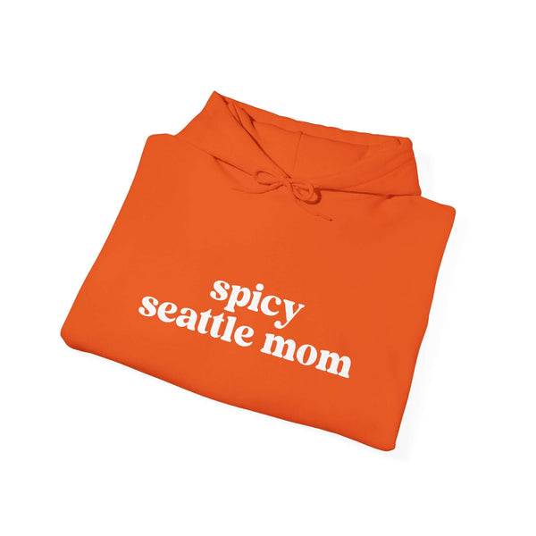 Bright orange hoodie with 'spicy seattle mom' text, showcasing a cozy and sassy style for Seattle moms.
