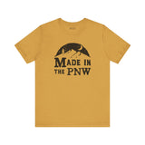 Made in the PNW T Shirt – Distressed Mountain Graphic Tee in a mustard color with graphic design.