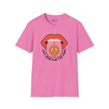Pink I'm Just Here for the Vibes T-Shirt with graphic lips and peace symbol design.