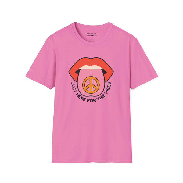Pink I'm Just Here for the Vibes T-Shirt with graphic lips and peace symbol design.
