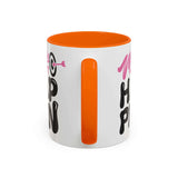 Make It Happen Mug with vibrant orange interior and bold hand-lettered design on glossy white surface.