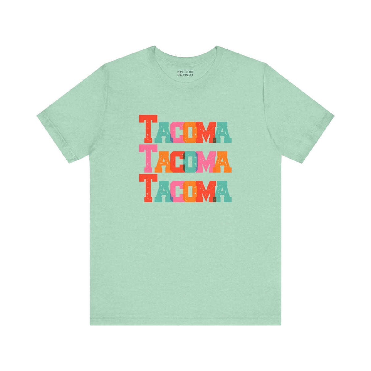 Bold Tacoma Trio Soft Tee with colorful block-letter design on mint green fabric.