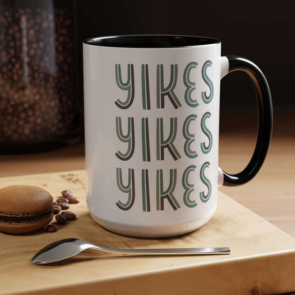 Retro Yikes Coffee Mug with playful typographic design and bold contrasting handle, perfect for coffee lovers.