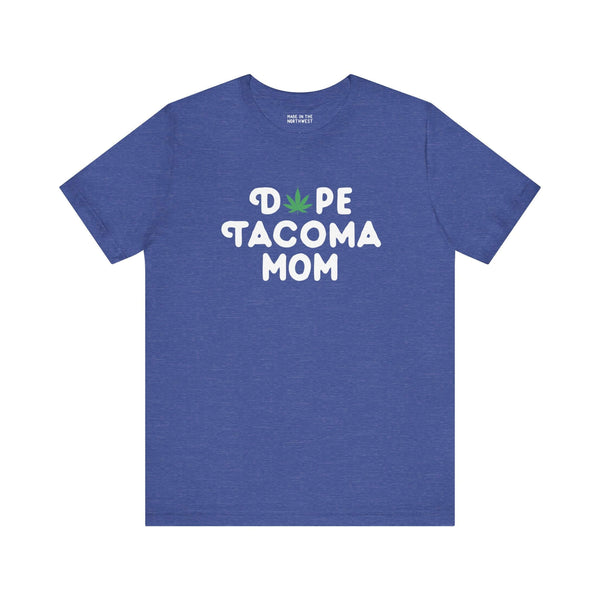 Blue "Dope Tacoma Mom" tee with marijuana leaf design in place of "O", celebrating local Washington style.