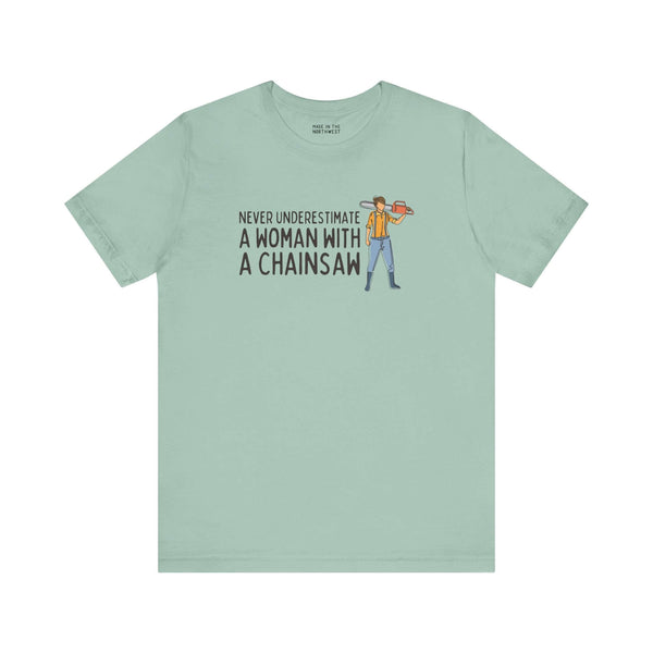 Graphic tee featuring the phrase 'Never Underestimate a Woman with a Chainsaw', designed for strong women.
