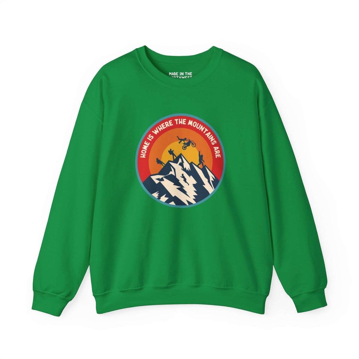 Green sweatshirt with "Home is Where the Mountains Are" design, featuring PNW outdoor activities and a hidden Bigfoot in a colorful circle.