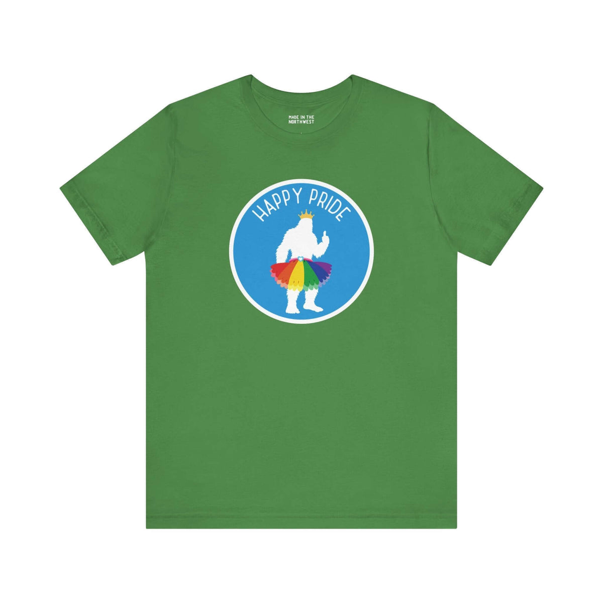 Green tee with Bigfoot silhouette in rainbow tutu and crown, celebrating Pride with "Happy Pride" text. Whimsical and festive design.