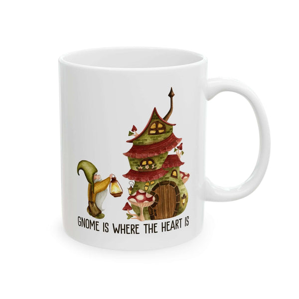 Ceramic mug featuring a gnome and cozy mushroom house with text 'Gnome Is Where The Heart Is'.