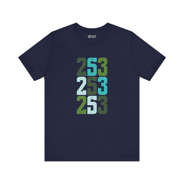 Navy soft tee featuring a stacked bold design celebrating Tacoma's 253 in vibrant greens and blues.