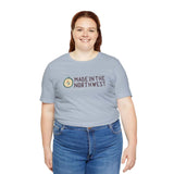 Woman wearing Made in the Northwest original logo soft tee with compass design, symbolizing Pacific Northwest pride and adventure.