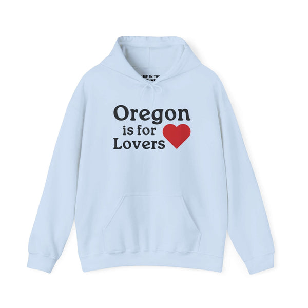 Light blue hoodie with "Oregon is for Lovers" and a red heart, celebrating Oregon's charm and beauty.