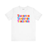 Bold and Bright Vancouver Trio Soft Tee with colorful block-letter design showcasing the city name stacked thrice on a white background.