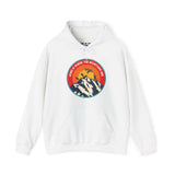 White hoodie featuring 'Home is Where the Mountains Are' with a colorful Pacific Northwest design of mountains and Bigfoot.