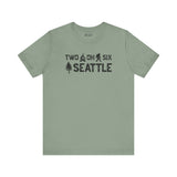 Two Oh Six Roots premium soft tee in green showcasing Seattle pride with axe and tree design.
