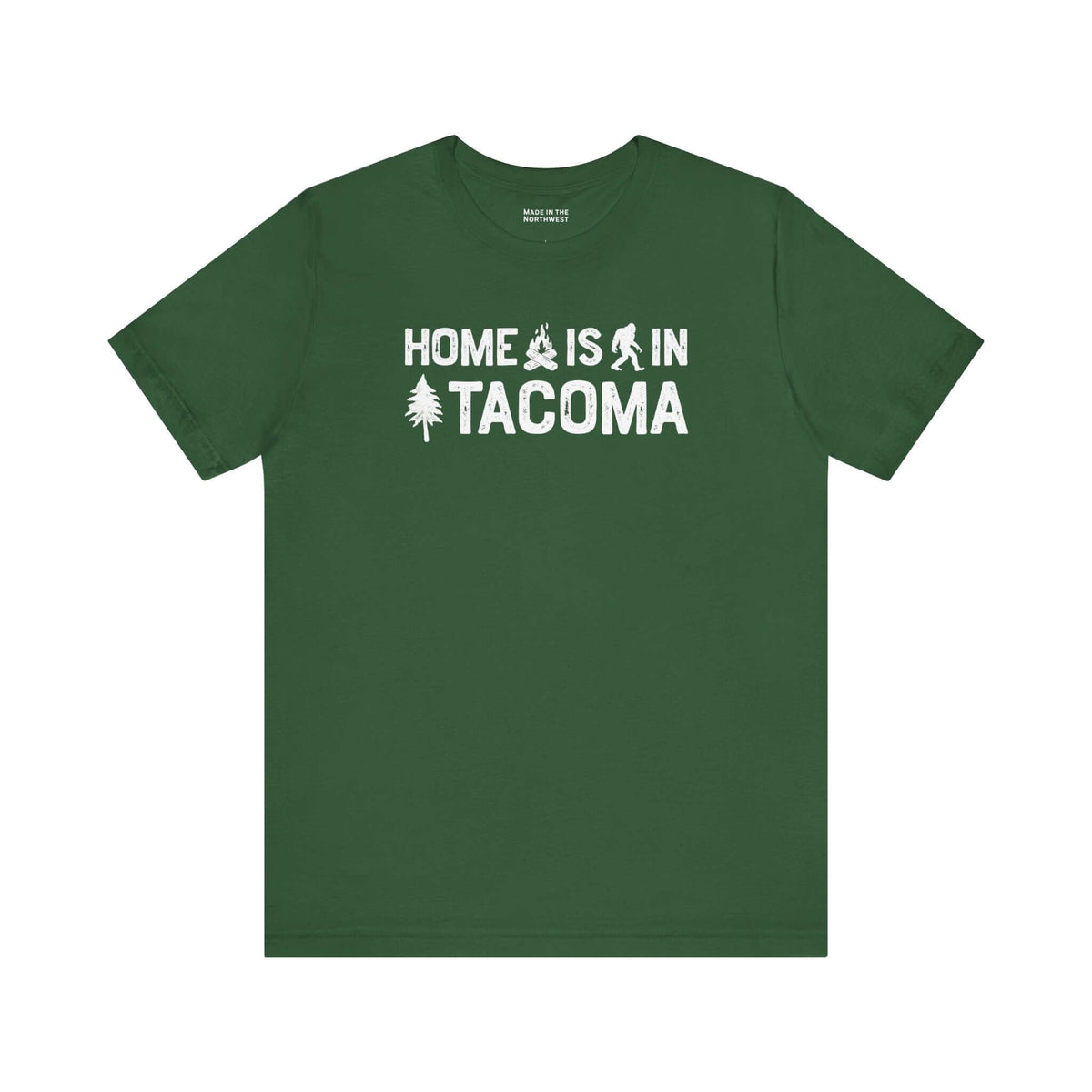 Home is in Tacoma tee in green color featuring Bigfoot and tree graphics.