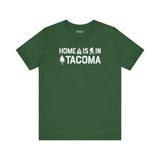 Home is in Tacoma tee in green color featuring Bigfoot and tree graphics.