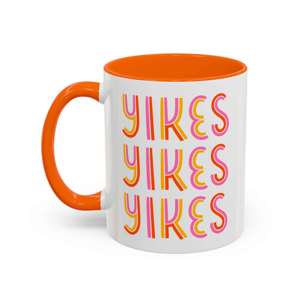 Retro Yikes Coffee Mug with bold colors and playful typography on a glossy ceramic surface.