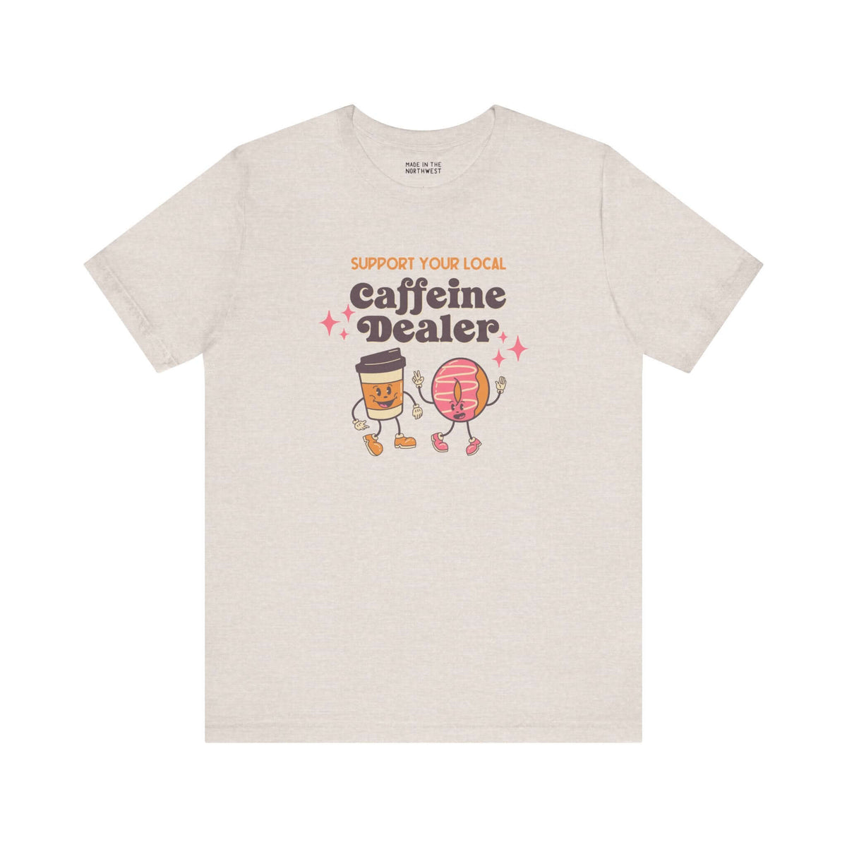 Support Your Local Caffeine Dealer coffee soft tee with playful graphic design featuring coffee cups and donuts.