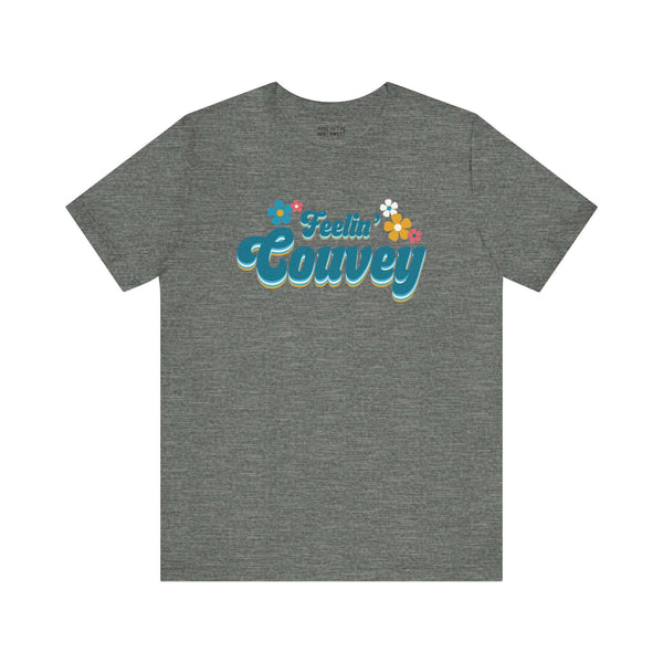 Feelin' Couvey Retro Soft Tee Embrace the vibrant spirit of Vancouver, Washington with our "Feelin' Couvey" Retro Tee! This playful design features the phrase "Feelin' Couvey" in a nostalgic 70s font, complete with colorful aqua and pink flowers. A fun tw