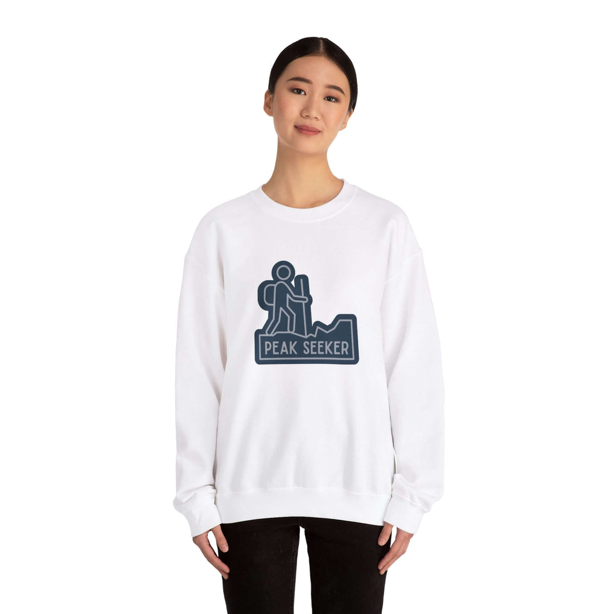 Woman wearing a Peak Seekers Hiking Lovers crewneck sweatshirt with a hiker graphic.