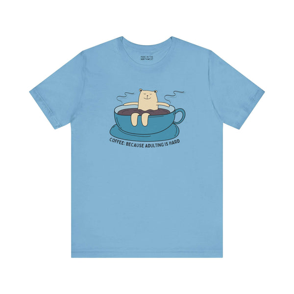 Coffee Because Adulting is Hard tee featuring a bear in a cup, perfect for caffeine lovers and casual wear.