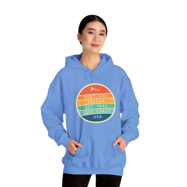 Portland Edition Hoodie with circular logo celebrating the Left Coast and Pacific Northwest, worn by a person.