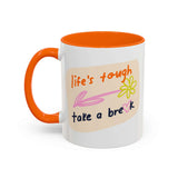 Life's Tough Take a Break Mug with cheerful design and orange handle for a uplifting coffee moment.