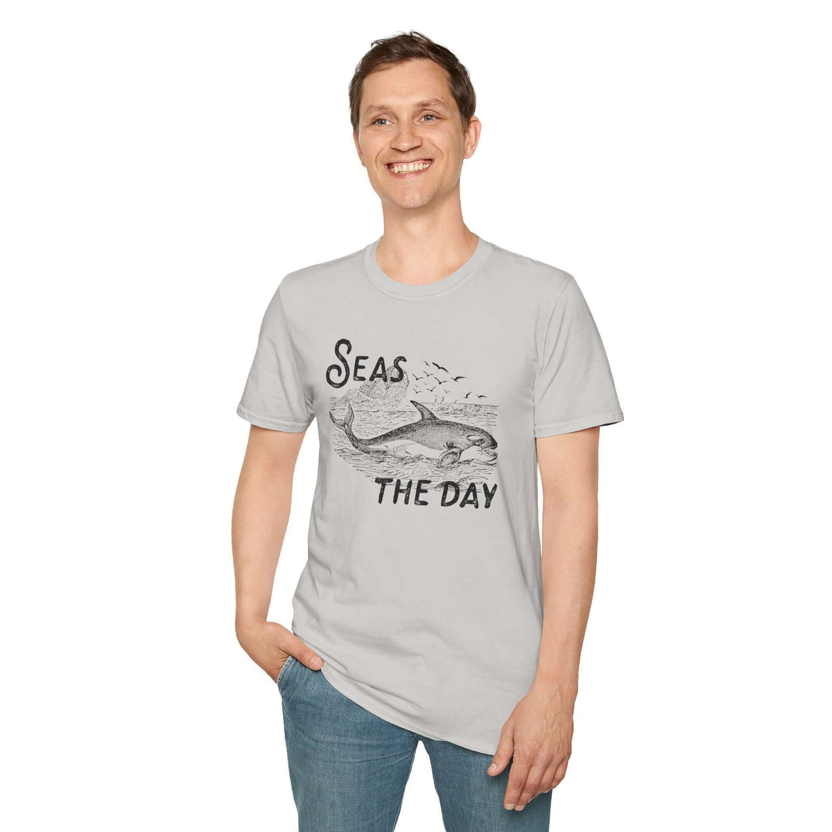 Man smiling in a Seas the Day T Shirt featuring an orca design, radiating coastal charm and ocean vibes.