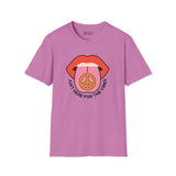 Pink softstyle t-shirt featuring bold lips and a peace symbol design, perfect for laid-back vibes and good times.