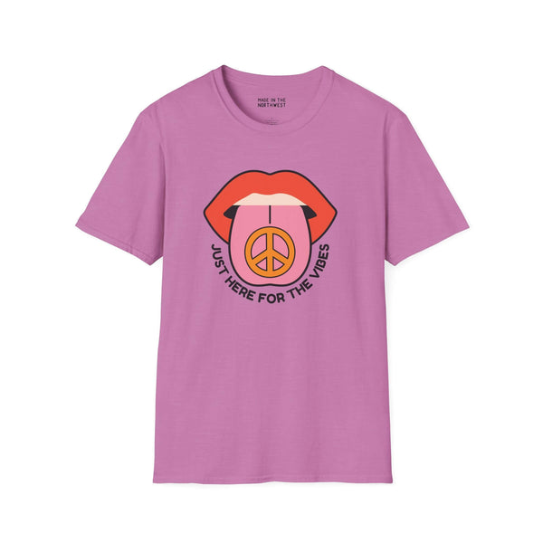 Pink softstyle t-shirt featuring bold lips and a peace symbol design, perfect for laid-back vibes and good times.