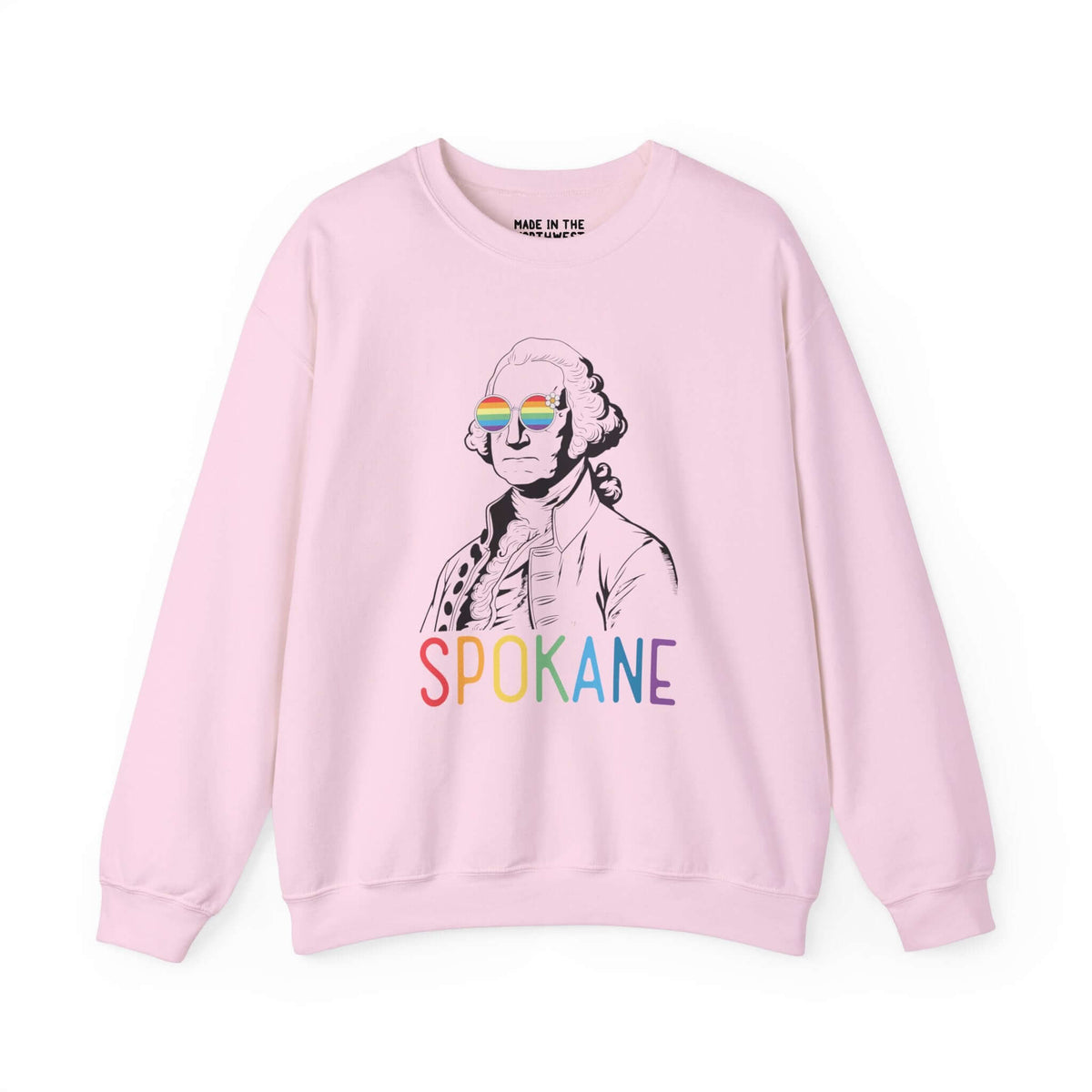 Pink sweatshirt with George Washington wearing rainbow glasses and "Spokane" in colorful letters, celebrating Pride and inclusivity.