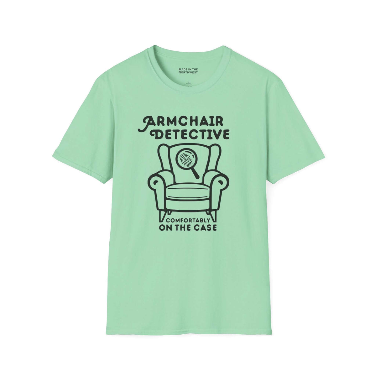 Armchair Detective T Shirt – Cozy True Crime Graphic Tee in mint green with armchair and magnifying glass design.