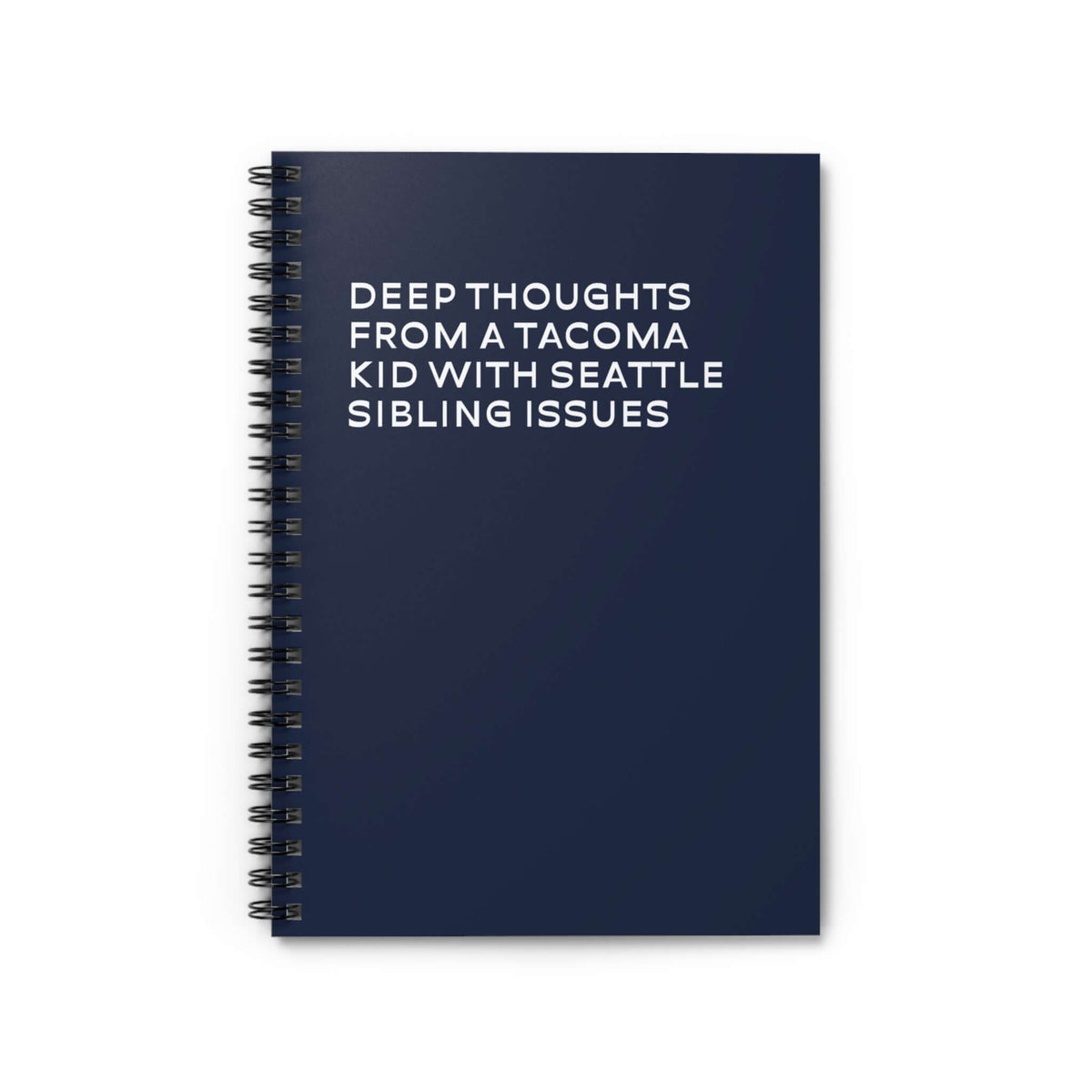 Spiral notebook titled 'Deep Thoughts from a Tacoma Kid with Seattle Sibling Issues' on a navy blue cover.