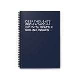Spiral notebook titled 'Deep Thoughts from a Tacoma Kid with Seattle Sibling Issues' on a navy blue cover.