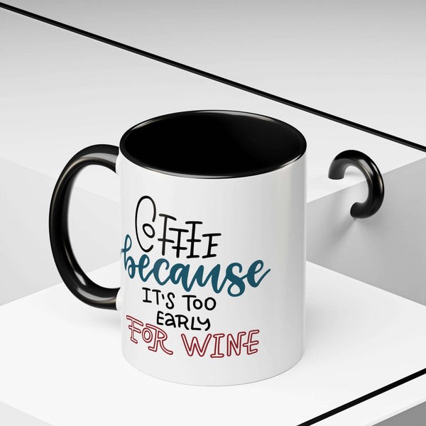 Coffee Because It's Too Early for Wine Mug with black handle and interior, featuring playful text design.