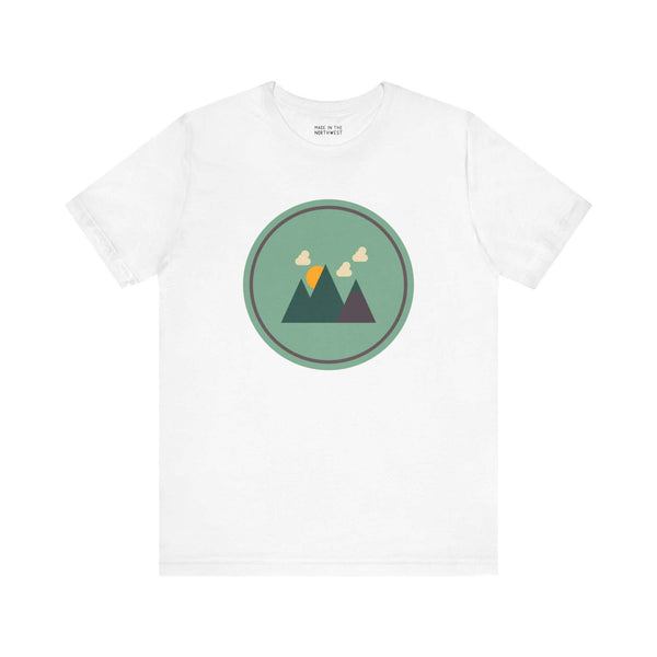 Minimalist forest tee with a Northwest style, featuring a simple mountain and forest silhouette in green, perfect for nature lovers.