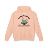 Coffee Makes Me Feel Less Murdery Hoodie in peach color featuring a playful coffee-themed design.