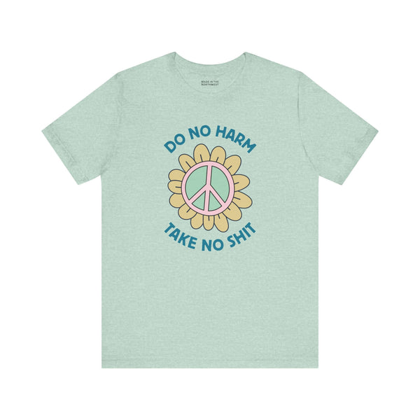 Do No Harm Take No Shit Tee featuring a peace flower design on a mint green t-shirt.