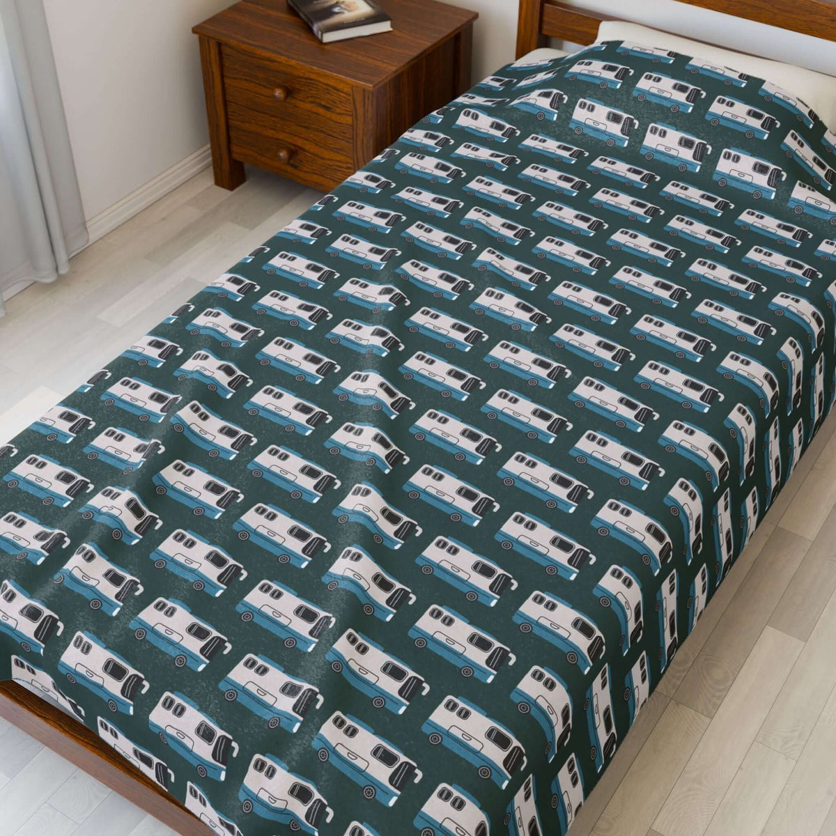 Highway Hideaway Class A Motorhome Lightweight Cozy Blanket with a repeating motorhome pattern on a bed.