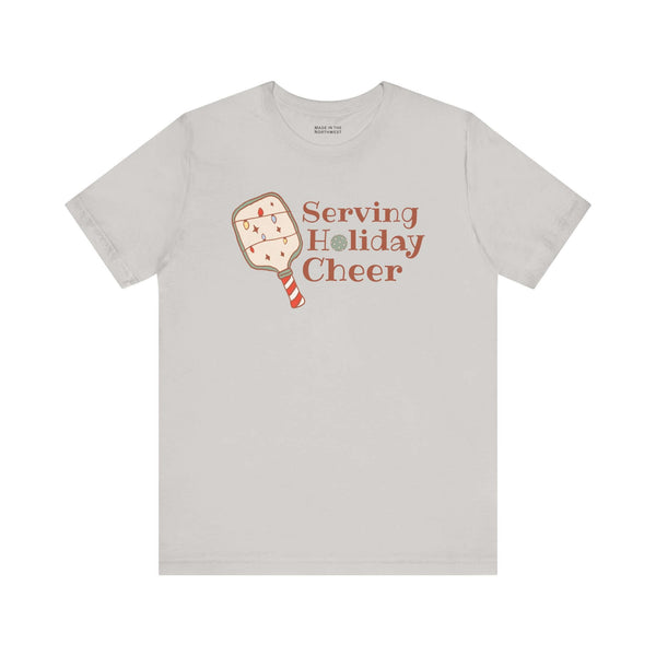 Serving Holiday Cheer Pickleball T Shirt featuring a festive paddle and playful text.