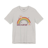 Have a Gay Day T Shirt featuring a colorful rainbow and daisies on a light background.