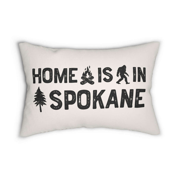 Home is in Spokane Lumbar Accent Pillow featuring bold text, sasquatch, and tree design.