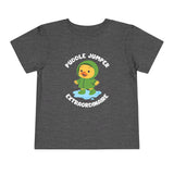 Puddle Jumper Extraordinaire Toddler Tee featuring a duck in a green raincoat splashing in a puddle.