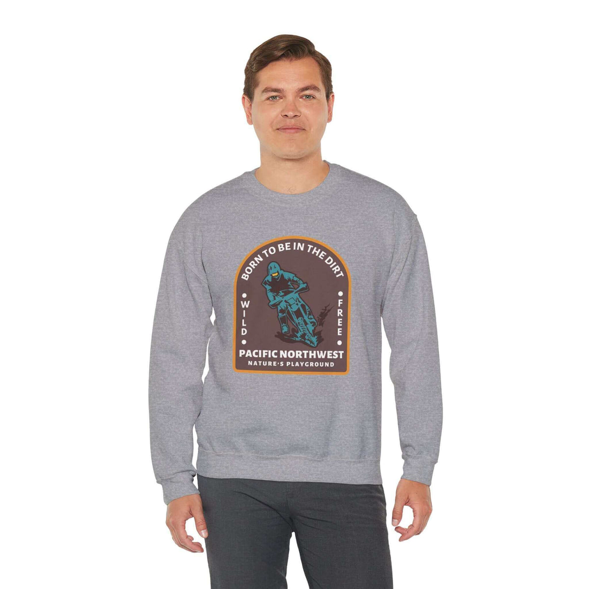 Man wearing gray "Born to Be in the Dirt" sweatshirt with outdoor adventure design.